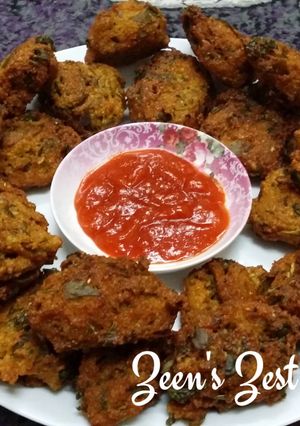 A picture of Moong Daal Fritters with Purslane Leaves.