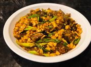 A picture of mapo tofu with mushrooms