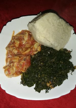 A picture of Mushroom, kales and ugali.