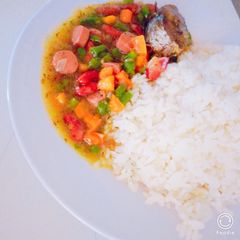 A picture of White rice and veggies sauce.