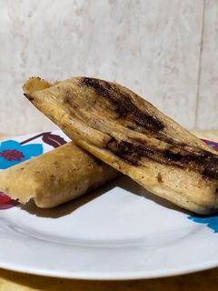 Una foto de Tamales de mole negro ✨