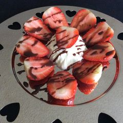 A picture of Strawberries with Chantilly Cream and Chocolate.