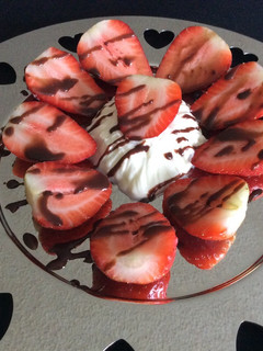 A picture of Strawberries with Chantilly Cream and Chocolate.