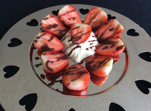 A picture of Strawberries with Chantilly Cream and Chocolate.