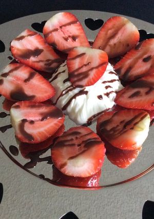 A picture of Strawberries with Chantilly Cream and Chocolate.