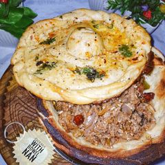 A picture of Qeema with bowl Naan.
