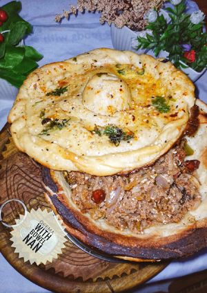 A picture of Qeema with bowl Naan.