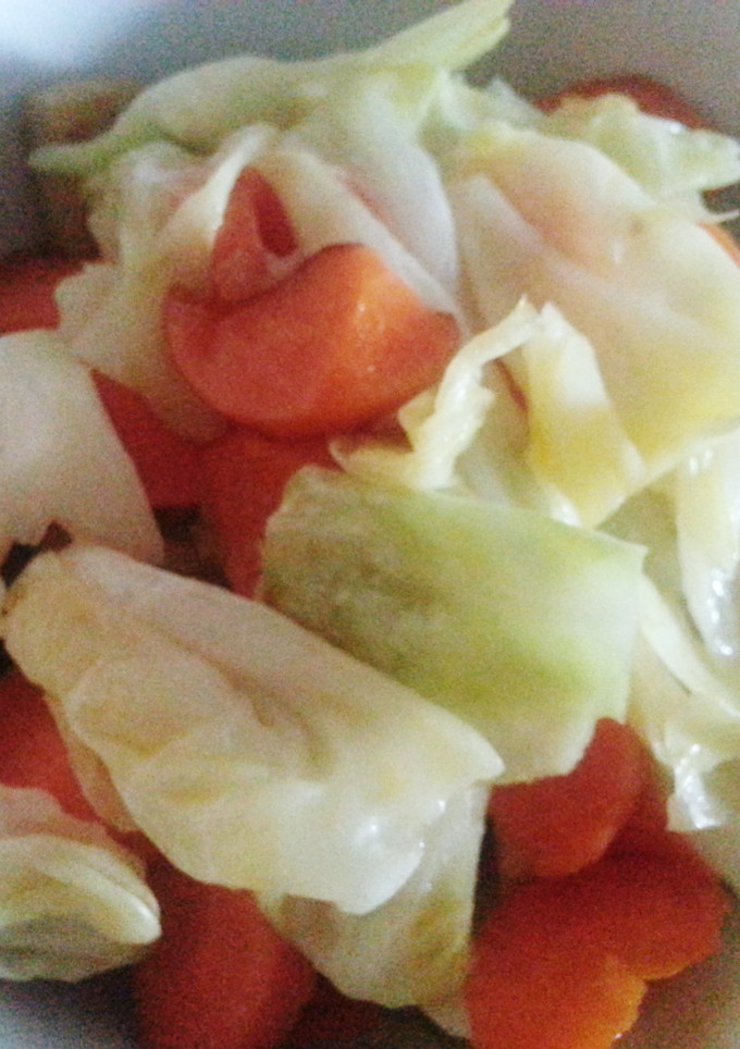 A picture of Cabbage with carrot and fish cake.
