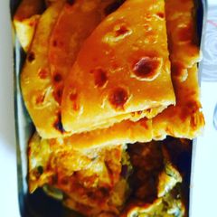 A picture of Paratha with egg omelette.