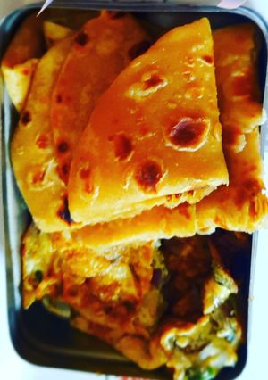 A picture of Paratha with egg omelette.