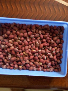 A picture of Roasted ground nuts in a salted pan.