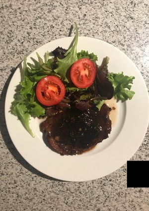 Una foto de Carne encebollada