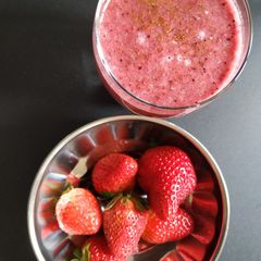 A picture of Banana, strawberries and orange smoothie.