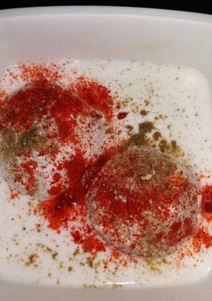 A picture of Coconut stuffed bread dahi wada.