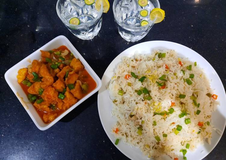 Chicken manchurian and egg vegetable fried rice with fresh lime