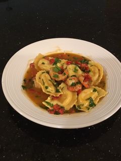 A picture of Chili Lemon Shrimp with Lobster Ravioli.