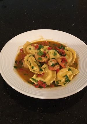 A picture of Chili Lemon Shrimp with Lobster Ravioli.