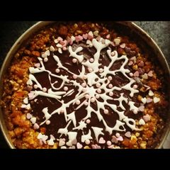 A picture of Very chocolaty cake with snowflake.