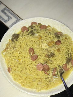 A picture of Indomie with sausage X chicken X beef.