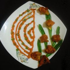 Crispy Cauliflower Popcorns Served with Crispy Spiral A picture of Crispy Cauliflower Popcorns Served with Crispy Spiral.