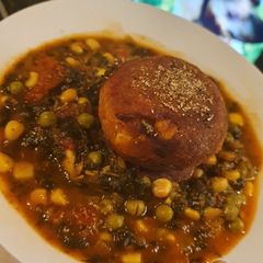 A picture of Veggie Balls with Spinach Sauce.