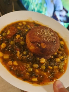 A picture of Veggie Balls with Spinach Sauce.