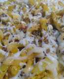 Revuelto de patatas, pollo, y pimientos, con queso