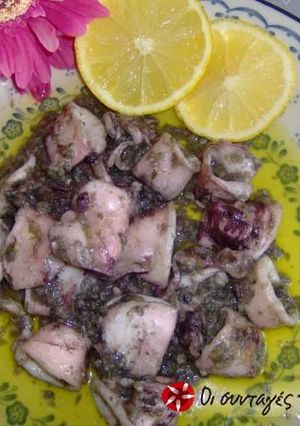 A picture of Kalamarakia in oil with spices.