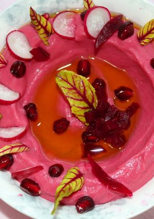 A picture of Hummus with Tahini and Beetroot.