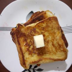 A picture of French toast with butter.