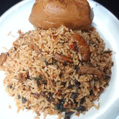 A picture of Local jollof rice with moimoi.