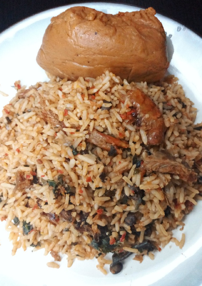 A picture of Local jollof rice with moimoi.