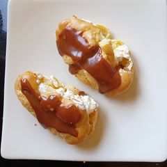A picture of Messy Orange Flavoured Chocolate Choux Buns.