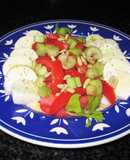 Mozzarella de búfalo con tomates, pencas de apio y piñones
