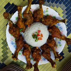 A picture of B B Q drumsticks.
