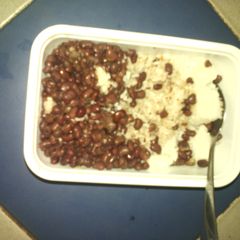 Boiled rice served with beans A picture of Boiled rice served with beans.