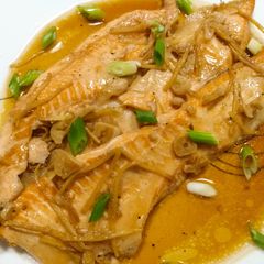A picture of Salmon bellies braised in sweet soy and ginger.