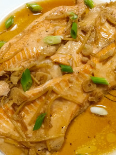 A picture of Salmon bellies braised in sweet soy and ginger.