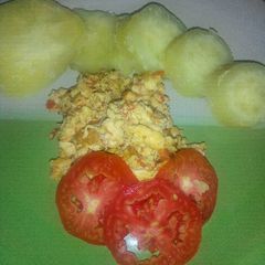 A picture of Sweet Potato, fried eggs and tomatoes.