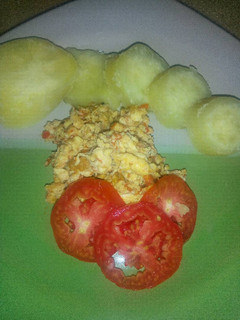 A picture of Sweet Potato, fried eggs and tomatoes.