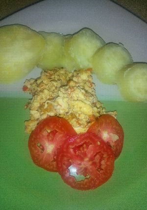 A picture of Sweet Potato, fried eggs and tomatoes.