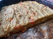 Una foto de fainá de queso
