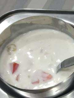 A picture of Tomato Cucumber Raita.