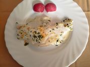 Una foto de merluza bechamel