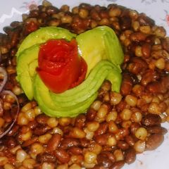 A picture of Chillie infused githeri with tomato rose and avocado rose.