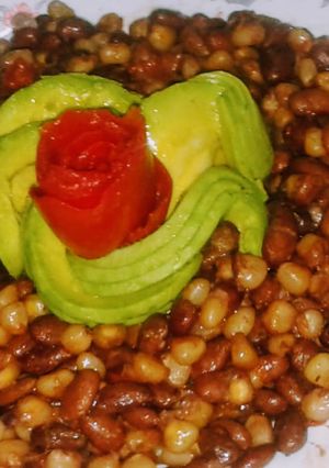 A picture of Chillie infused githeri with tomato rose and avocado rose.