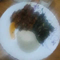 A picture of Wet fry beef, Spinach in coconut cream and ugali.