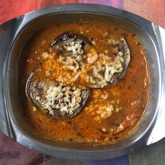 A picture of Eggplant cheese sandwich in raw mango gravy.