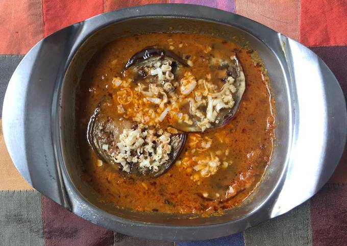 Eggplant cheese sandwich in raw mango gravy