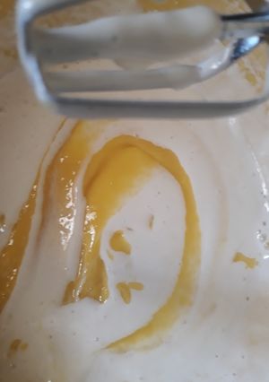 A picture of Mango mousse with cream made using aquafaba.